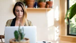 Relaxed woman working from home on her laptop