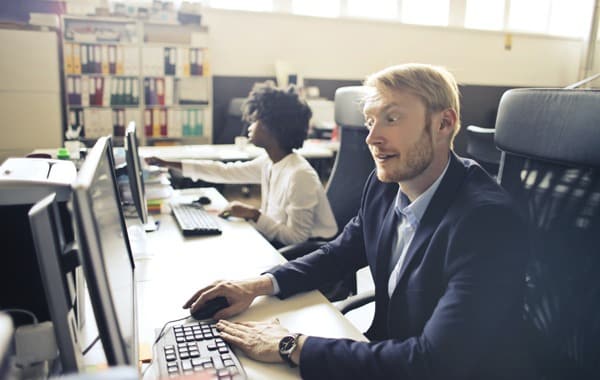 man using computer while working