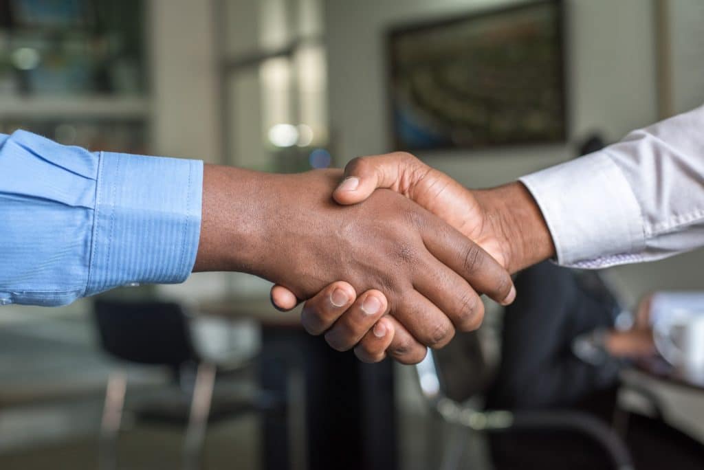 two person shaking hands