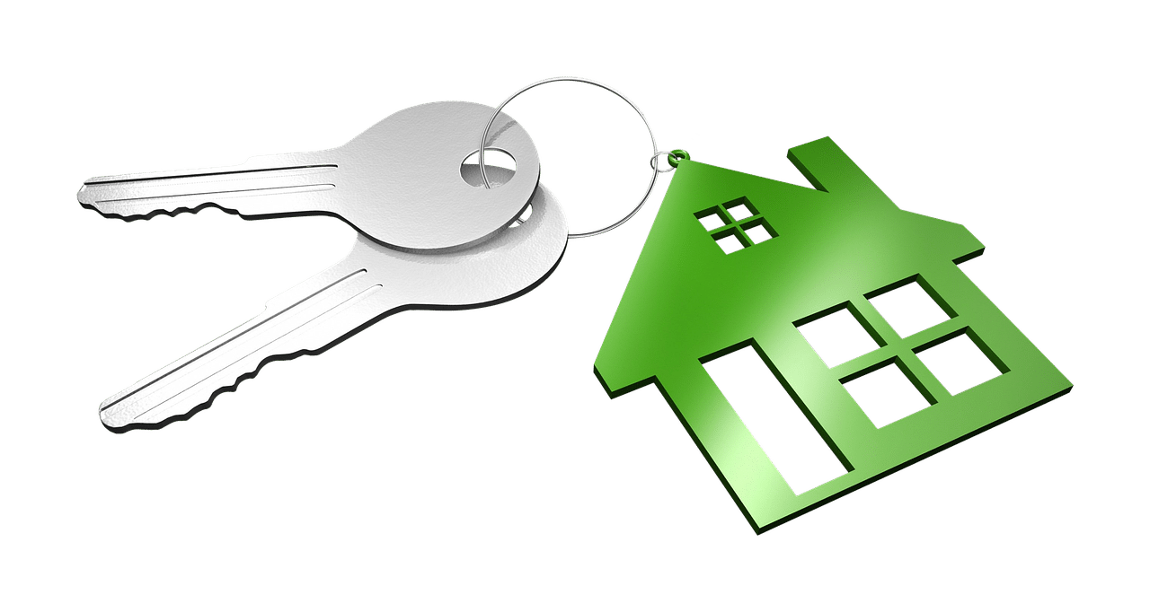 Keys with a green house logo